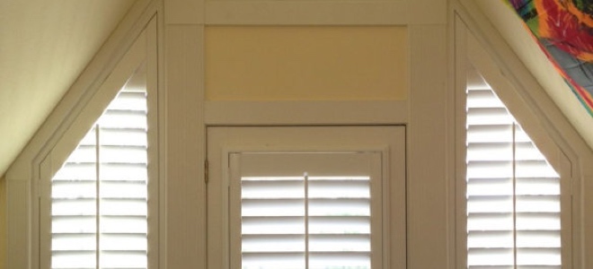 Slanted sidelights outside a door.